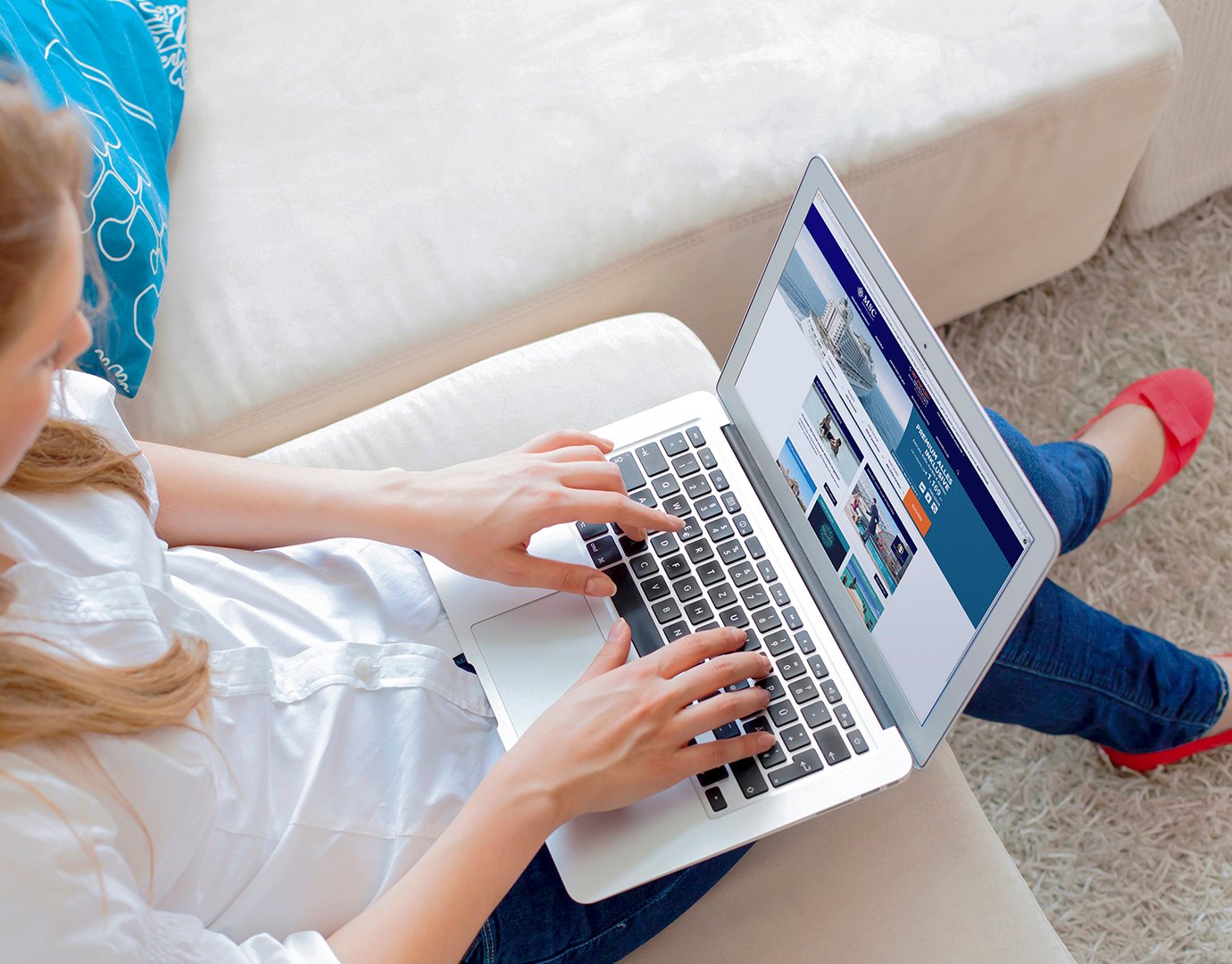 A woman browsing MSC Cruises' website on a laptop | MSC Cruises A woman browsing MSC Cruises' website on a laptop | MSC Cruises