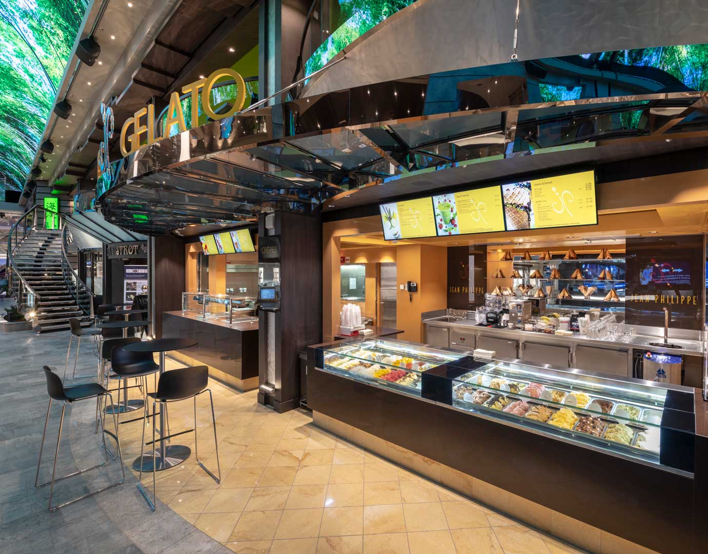 Gelato and dessert counter on an MSC cruise ship with modern design and seating area | MSC Cruises Gelato and dessert counter on an MSC cruise ship with modern design and seating area | MSC Cruises